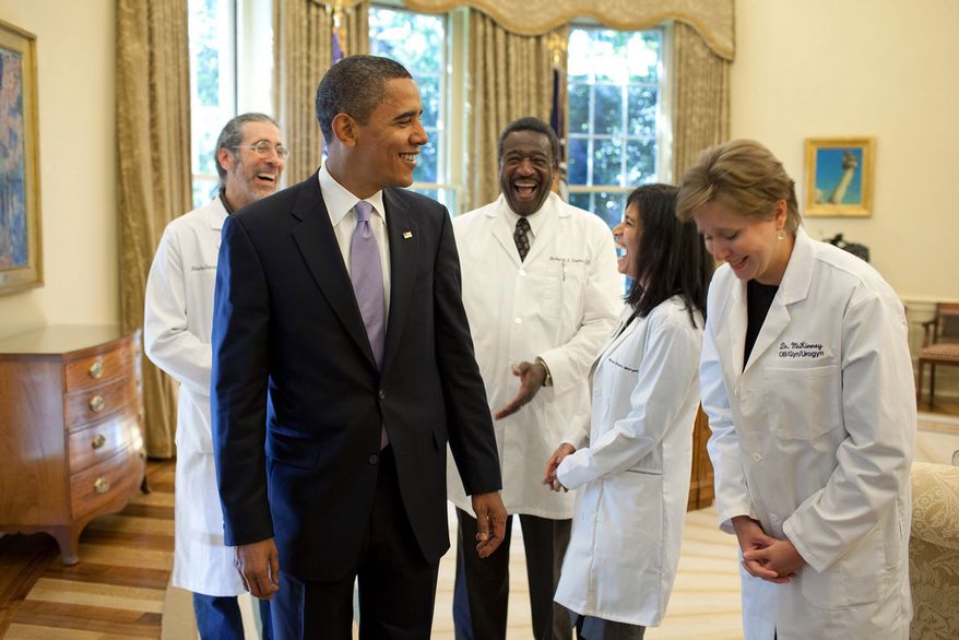 President Barack Obama shares a humorous moment with a group of doctors from around the country in the Oval Office, Oct. 5, 2009, prior to a health insurance reform event at the White House.
(Official White House Photo by Pete Souza)