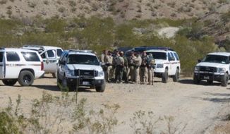 Rancher Clive Bundy snapped this picture of federal officials gathering near his Nevada property. (credit: Washington Free Beacon)