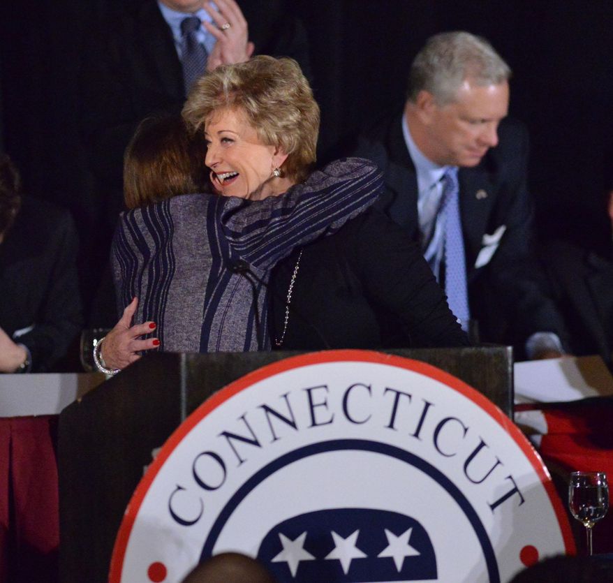 Greenwich resident, Linda McMahon, right, receives a hug from State Representative, Livvy Floren, R-149th District, during the 36th annual Prescott Bush Awards Dinner at the Stamford Hilton, Stamford, Conn., Thursday night, April 10, 2014. The Connecticut Republican Party bestowed two-time U.S. Senate candidate Linda McMahon with its highest honor. The former wrestling executive was chosen as this year's recipient of the Prescott Bush Award, named in honor of the late Prescott Bush Sr. of Greenwich, Conn., a former U.S. Senator and father of former President George H. W. Bush. Former Florida Gov. Jeb Bush, grandson of Prescott Bush, was the keynote speaker at the event. (AP Photo/The Time, Bob Luckey)