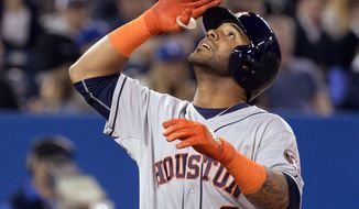Houston Astros&#39; Jonathan Villar salutes after hitting a three-run home run off Toronto Blue Jays starting pitcher R.A. Dickey during the seventh inning of baseball game in Toronto on Thursday, April 10, 2014. (AP Photo/The Canadian Press, Frank Gunn)