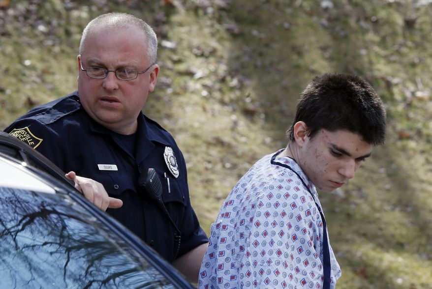 AP10thingsToSee - Alex Hribal, the suspect in the multiple stabbings at the Franklin Regional High School in Murrysville, Pa., is escorted by police to a district magistrate to be arraigned in Export, Pa. on Wednesday, April 9, 2014. Authorities say Hribal has been charged after allegedly stabbing and slashing at least 19 people, including students, in the crowded halls of his suburban Pittsburgh high school Wednesday. (AP Photo/Keith Srakocic)