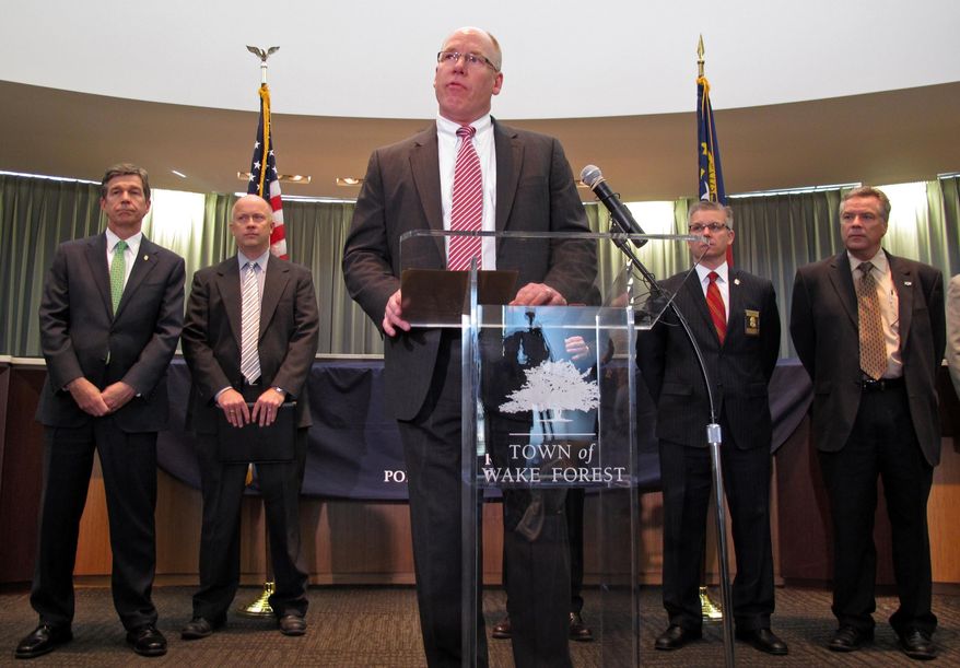 John Strong, FBI special agent in charge of North Carolina, addresses members of the media during a press conference at the Wake Forest Town Hall on Thursday, April 10, 2014, in Wake Forest, N.C. Strong said the kidnapping of Frank Arthur Janssen was related to his daughter's prosecution of North Carolina prisoner Kelvin Melton, who is serving a life sentence for his 2012 conviction for being a habitual felon. Melton, 49, was also convicted of assault with a deadly weapon with intent to kill. (AP Photo/Allen G. Breed)
