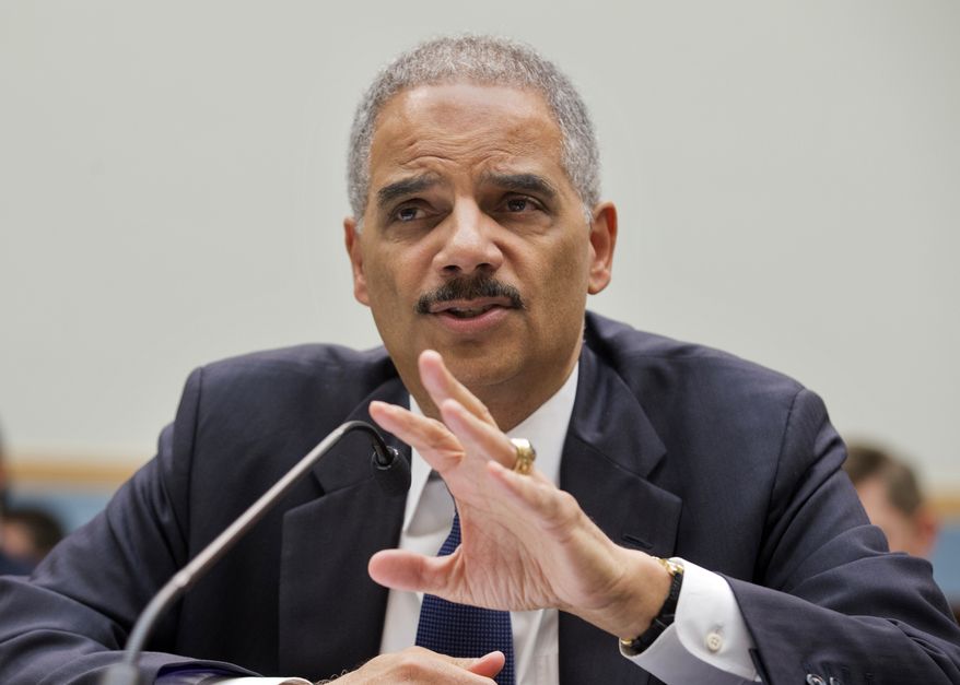 FILE - This April 8, 2014 file photo Attorney General Eric Holder testifies on Capitol Hill in Washington. An Internet connection and a stolen identity are all it takes for crooks to collect billions of dollars in stolen federal tax refunds, and the scam is proving too pervasive to stop. A watchdog report in November says the IRS issued $4 billion in fraudulent tax refunds over the previous year to criminals using someone else’s personal information. Holder said this week that the “scale, scope and execution of these fraud schemes” has grown substantially and that the Justice Department in the last year has charged 880 people with such crimes. (AP Photo/Manuel Balce Ceneta, File)
