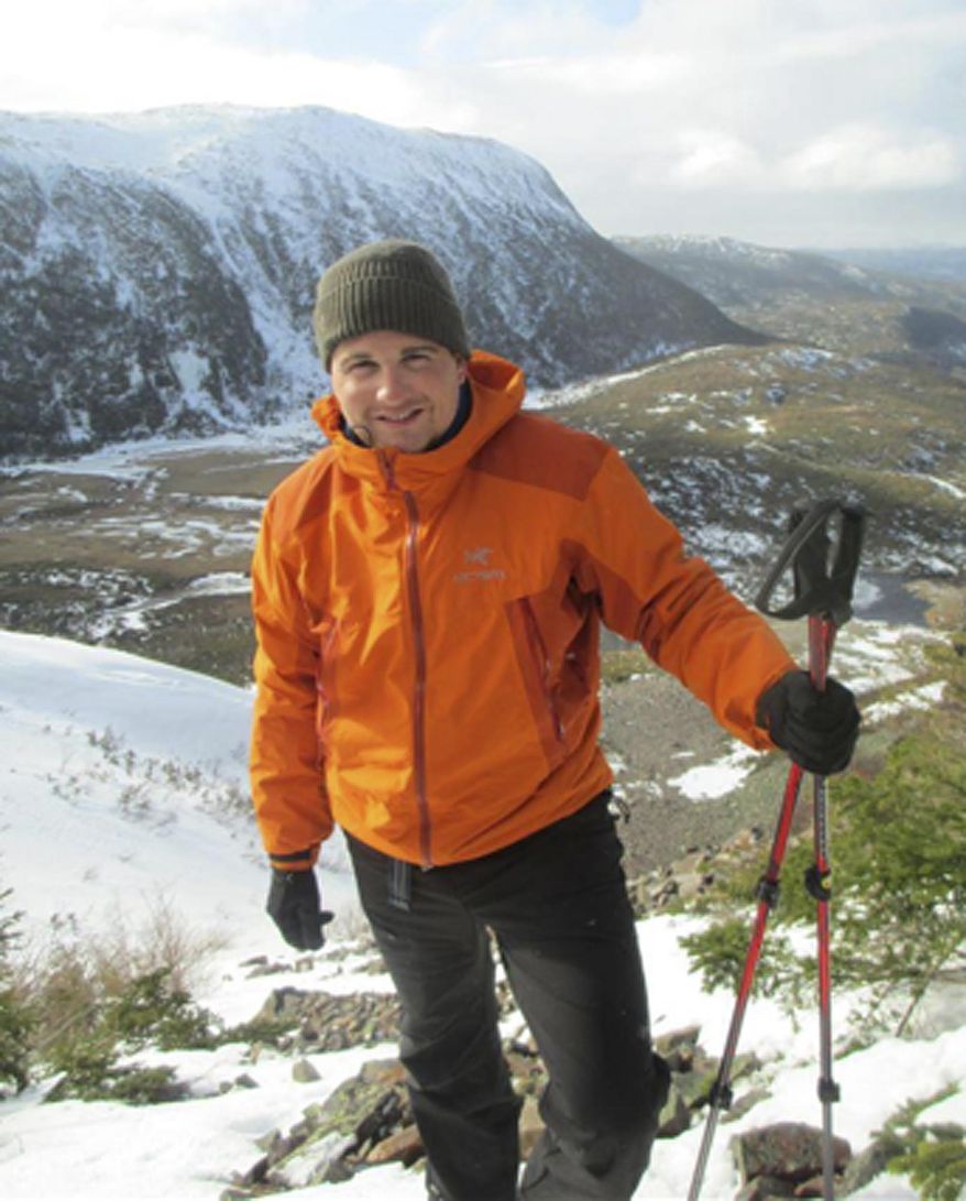 ADVANCE FOR USE SATURDAY, APRIL 12, 2014 AND THEREAFTER - This March 2013 photo provided by Nicole Lynch shows her brother, Sean Collier, during a trip to Newfoundland, Canada. Collier, a Massachusetts Institute of Technology police officer, was shot to death, allegedly by the two suspects in the Boston Marathon bombings on April 19, 2013. (AP Photo/Nicole Lynch)