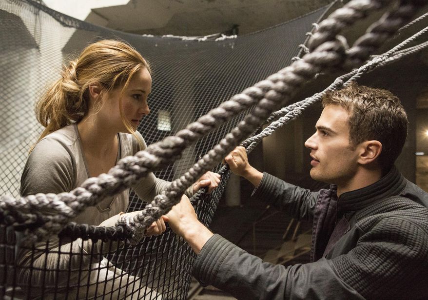 This image released by Summit Entertainment shows Shailene Woodley, left, and Theo James in a scene from "Divergent." Lions Gate Entertainment Corp. says the final book of its "Divergent" trilogy will be made into two parts, following the lucrative formula it has used for "Twilight" and is repeating for "The Hunger Games." (AP Photo/Summit Entertainment, Jaap Buitendijk, file)