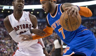 Toronto Raptors guard Terrence Ross (31) defends New York Knicks forward Carmelo Anthony during the first half of an NBA basketball game Friday, April 11, 2014, in Toronto. (AP Photo/The Canadian Press, Frank Gunn)