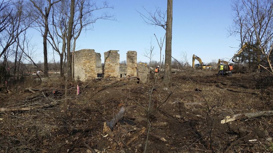 In this photo provided by Craig Kreman, one of the various remnant structures of a former Catholic mission in Quapaw, Okla., is pictured on Friday, March 7, 2014 during remedial activities on the Catholic 40 site. The Catholic school, St. Mary’s of the Quapaws, ran from 1894 until 1927 when funding was dismissed and the property vacated. The Quapaw Tribe is cleaning up the site, which was leased to various companies and mined for lead and zinc. When mining stopped, large piles of leftover mining waste were left behind. This caused health problems for residents. (AP Photo/Craig Kreman)