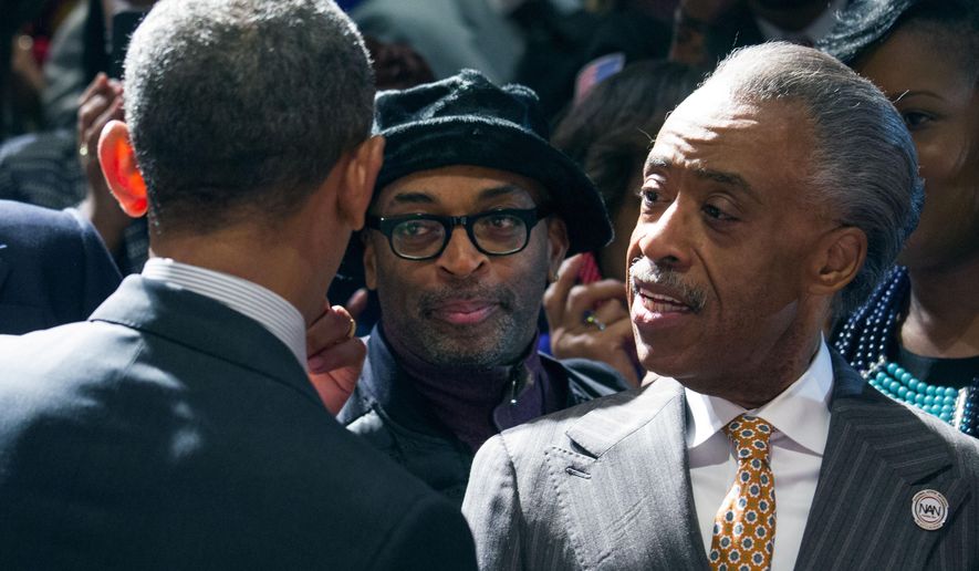 President Barack Obama greets film director, producer, writer and actor Spike Lee, left,  and the Rev. Al Sharpton, Friday, April 11, 2014, at the National Action Network conference, in New York. (AP Photo/Newsday, Craig Ruttle, Pool)