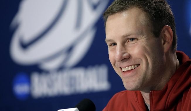 FILE - In this March 22, 2014 file photo, Iowa State coach Fred Hoiberg smiles as he answers a question during an NCAA college basketball tournament news conference in San Antonio. Iowa State has given Hoiberg a $600,000 a year raise, bumping his average annual salary to $2.6 million in an effort to keep &amp;quot;The Mayor&amp;quot; in Ames for life. The Cyclones announced a revised contract for Hoiberg on Friday, April 11, 2014. (AP Photo/David J. Phillip, File)