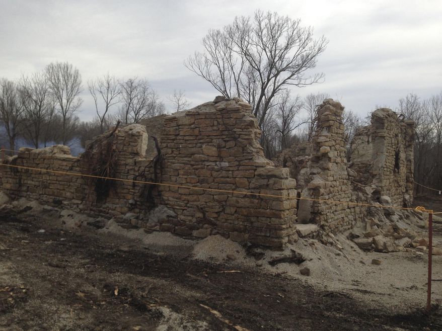 In this photo provided by Craig Kreman, one of the various remnant structures of a former Catholic mission in Quapaw, Okla., is pictured on Friday, March 7, 2014 during remedial activities on the Catholic 40 site. The Catholic school, St. Mary’s of the Quapaws, ran from 1894 until 1927 when funding was dismissed and the property vacated. The Quapaw Tribe is cleaning up the site, which was leased to various companies and mined for lead and zinc. When mining stopped, large piles of leftover mining waste were left behind. This caused health problems for residents. (AP Photo/Craig Kreman)