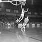 St. Louis Hawks rookie forward Lou Hudson (23) leaps to make a lay up against Philadelphia in St. Louis, on Jan. 31, 1967. Rookie Bill Melchionni seems to know better than to try to stop Hudson. (AP Photo)