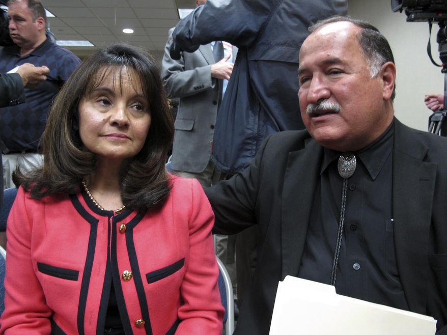 Renetta and Stephen Torres talk to reporters Thursday April 10, 2014, after the U.S. Justice Department released a report in response to a series of deadly Albuquerque police shootings. Their son, Christopher, who had struggled with schizophrenia, was shot and killed by Albuquerque police in April 2011 during an arrest attempt over a road rage charge. The report pointed to patterns of excessive force by the Albuquerque Police Department, serious constitutional violations and a lack of training and oversight of its officers. (AP Photo/Russell Contreras)