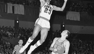 FILE - In this Jan. 31, 1967 file photo, St. Louis Hawks rookie forward Lou Hudson (23) goes to the basket against Philadelphia&#39;s Bill Melchionni, in St. Louis. Six-time All-Star Lou Hudson died Friday, April 11, 2014, in Atlanta, the Atlanta Hawks said. He was 69. (AP Photo/File)