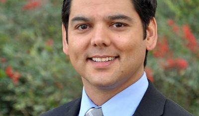 FILE - In this 2012 file photograph provided by the candidate&#39;s campaign, Democrat Raul Ruiz, who was elected to California&#39;s 36th Congressional District seat, poses for a photo. Ruiz has been voting with the Republican majority in the House to amend or overturn parts of the federal Affordable Care Act. Ruiz is one of a handful of Democrats in California who represent congressional districts that are closely divided between Democrats and Republicans, after voters approved an independent redistricting process. (AP Photo/Ruiz Campaign, File)