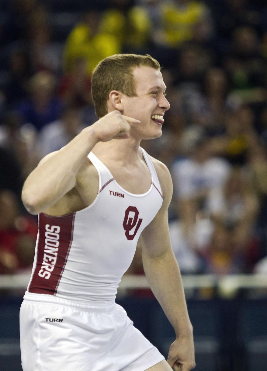 Oklahoma’s Alec Robin reacts after competing in the vault event during the individual event finals at the NCAA men's gymnastics championships in Ann Arbor, Mich., Saturday, April 12, 2014. Robin placed first. (AP Photo/Tony Ding)