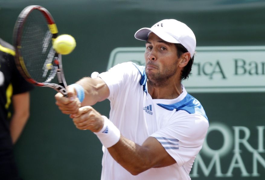 Fernando Verdasco of Spain returns a shot to Santiago Giraldo of Colombia in a semifinal match at the U.S. Men's Clay Court Championship, Saturday, April 12, 2014, in Houston. Verdasco won 6-4, 7-5. (AP Photo/Pat Sullivan)