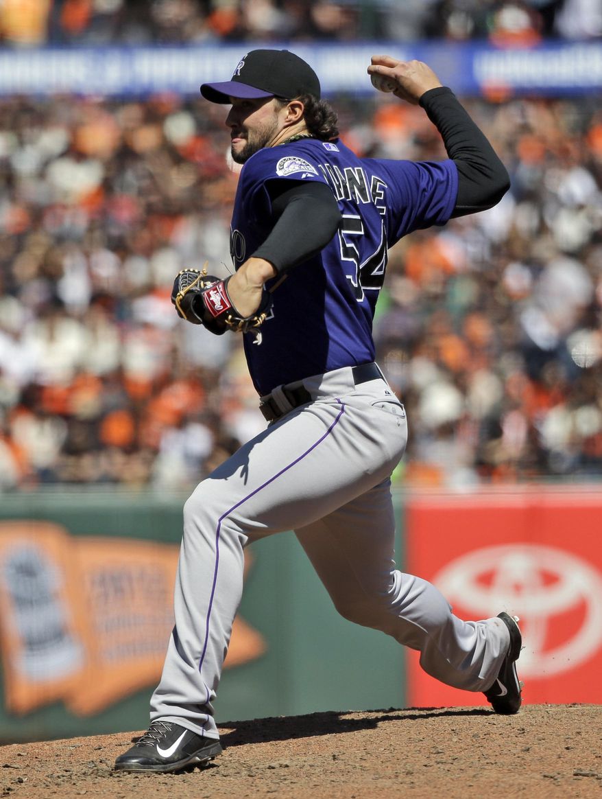 Colorado Rockies relief pitcher Tommy Kahnle throws to the San Francisco Giants during a baseball game on Saturday, April 12, 2014, in San Francisco. Colorado won 1-0. (AP Photo/Marcio Jose Sanchez)