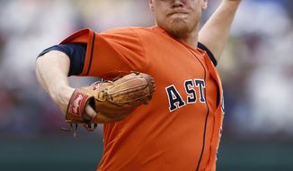 Houston Astros starting pitcher Brett Oberholtzer delivers a pitch to the Texas Rangers during the first inning of a baseball game, Sunday, April 13, 2014, in Arlington, Texas. (AP Photo/Jim Cowsert)