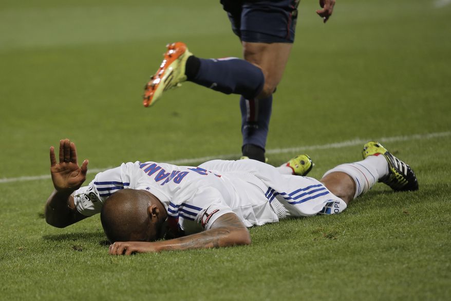 Lyon&#x27;s Jimmy Brian reacts during their French League One soccer match against Paris Saint Germain, in Lyon, central France, Sunday, April 13, 2014. (AP Photo/Laurent Cipriani)