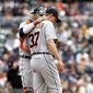 Detroit Tigers catcher goes out to the mound to confer with starting pitcher Max Scherzer during fourth inning play of a baseball game against the San Diego Padres Sunday, April 13, 2014, in San Diego. (AP Photo/Don Boomer)
