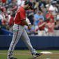 Washington Nationals starting pitcher Gio Gonzalez walks back to the mound after giving up a two-run home run to Atlanta Braves&#x27; Freddie Freeman in the second inning of a baseball game, Sunday, April 13, 2014, in Atlanta. (AP Photo/David Goldman)