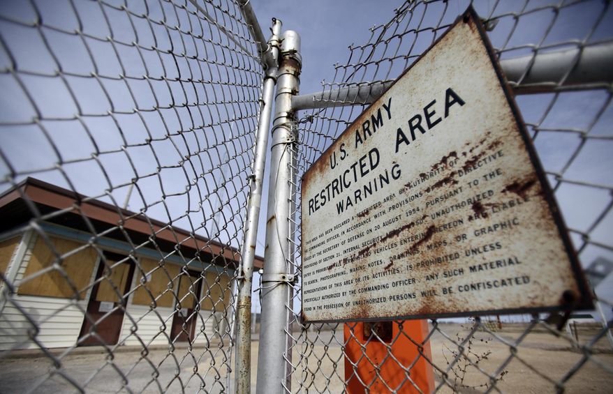 An old sign is posted near Gate House 6544 on the land formerly Badger Army Ammunition Plant near Baraboo, Wis., on April 10, 2014. The south central Wisconsin property where more than 23,000 people once toiled in making bullets, bombs and rockets during World War II and the Korean and Vietnam wars will be open to recreational visitors for the first time since the 1940s. Some 1,500 buildings have been removed from the former Badger Army Ammunition plant on 7,500 acres of land adjacent to Devils Lake State Park near Baraboo. Production of ammunition ended in 1975 and the deconstruction of the plant has been underway since 2004. (AP Photo/Wisconsin State Journal,M.P. King)