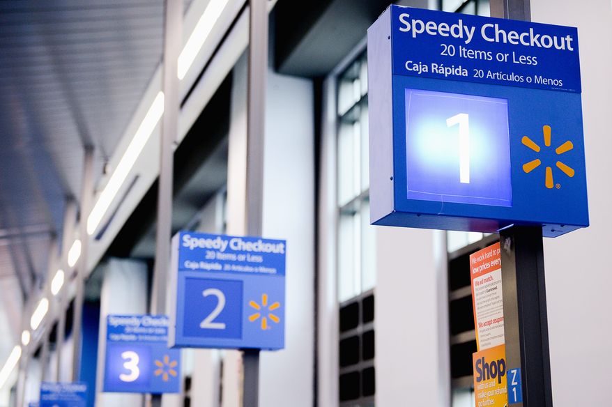 Signs at one of two of the District's Wal-Marts were found to have disparate information in English and Spanish. (Andrew Harnik/The Washington Times)