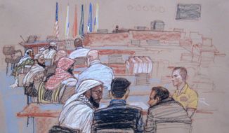 In this pool photo of a Pentagon-approved sketch by court artist Janet Hamlin, defendants speak with their defense lawyers during a break in pretrial hearings at the Guantanamo Bay U.S. Naval Base in Cuba, Monday, April 14, 2014. From right to left are Mustafa al Hawsawi, Ali Abdul Aziz Ali, Ramzi bin al Shibh, and Khalid Sheikh Mohammad sitting on the floor with Walid bin Attash sitting on a chair. A lawyer for one of five defendants in the Sept. 11 war crimes tribunal said Monday that FBI agents questioned a member of his defense team, apparently in an investigation related to the handling of evidence, a revelation that brought an abrupt halt to proceedings. (AP Photo/Janet Hamlin, Pool)