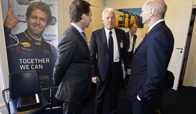 Red Bull technical director Adrian Newey, right, and Red Bull team principal Christian Horner, left, talk with Charlie Whiting, center, International Automobile Federation (FIA) Race Director, during an FIA Appeal Court hearing, Paris, Monday, April 14, 2014. The dispute resolution tribunal for motorsport is hearing Red Bull&#x27;s case against the disqualification of Daniel Ricciardo from the Australian Grand Prix. (AP Photo/Eric Vargiolu, Pool)