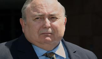 Former Bell city manager Robert Rizzo, listens to questions from the media, as he leaves the Edward R. Roybal Federal building and United States courthouse Monday, April 14, 2014. Rizzo was sentenced to 33 months in prison for income tax evasion on Monday. On Wednesday Rizzo faces sentencing in state court on 69 counts of fraud, misappropriation of public funds and other charges for his role in the Bell scandal. He pleaded no contest in that case in October. (AP Photo/Nick Ut)