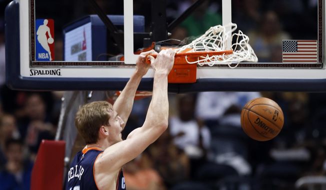 Charlotte Bobcats center Cody Zeller (40) scores against the Atlanta Hawks in the first half of an NBA basketball game against the Atlanta Hawks in Atlanta Monday, April 14, 2014.  (AP Photo/John Bazemore)