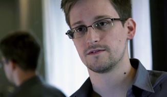 ** FILE ** A Sunday, June 9, 2013, file photo provided by The Guardian newspaper in London shows Edward Snowden, who worked as a contract employee at the U.S. National Security Agency. (AP Photo/The Guardian, File)