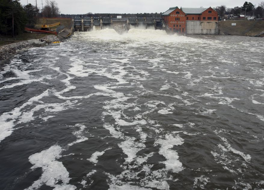 The Muskegon River swells at the Croton Dam in Newaygo, Mich., Monday, April 14, 2014. Several Michigan rivers are over their banks after three days of storms dropped as much of 5.5 inches of rain, forcing some flood plain residents from their homes. (AP Photo/The Grand Rapids Press, Cory Morse) ALL LOCAL TV OUT; LOCAL TV INTERNET OUT