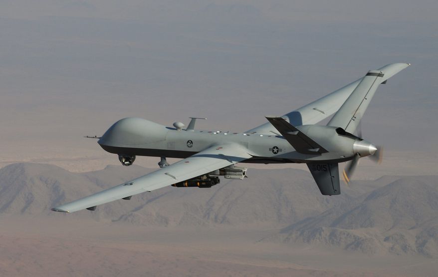 High hopes: The MQ-9 Reaper will be tested to determine whether flight time can be extended by housing fuel in its wings. (U.S. Air Force via Associated Press)