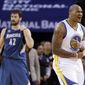 Golden State Warriors&#39; Marreese Speights (5) reacts after scoring and getting could next to Minnesota Timberwolves&#39; Kevin Love (42) during the first half of an NBA basketball game on Monday, April 14, 2014, in Oakland, Calif. (AP Photo/Marcio Jose Sanchez)
