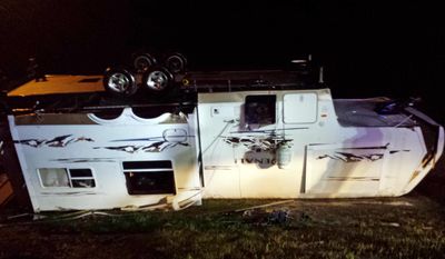 A camper trailer lies on its roof after being toppled by strong winds that blew through Santa Maria RV Park in Gautier, Miss., Monday night, April 14, 2014. Authorities also reported some downed trees and power lines in Moss Point. (AP Photo/The Sun Herald, Blake Kaplan)