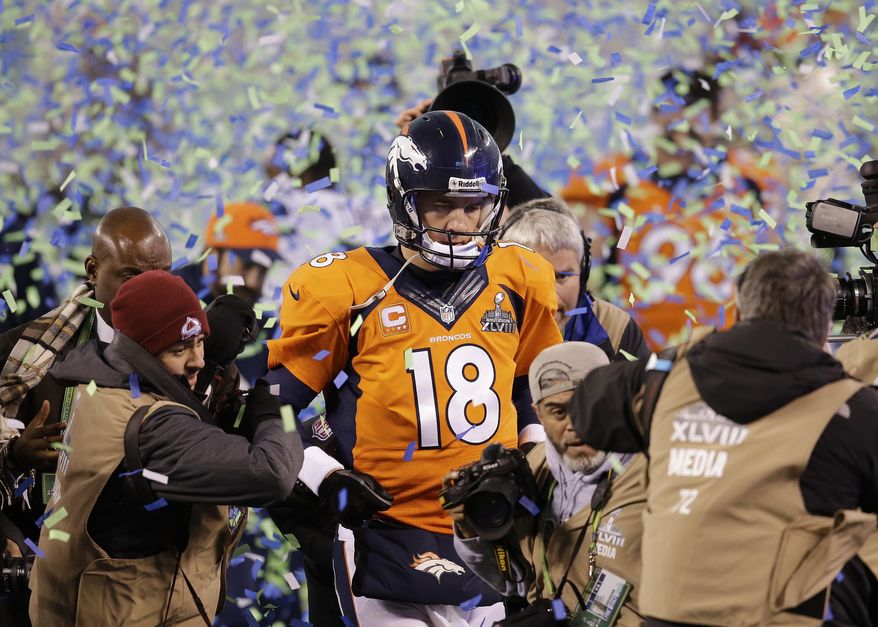FILE - In this Feb. 2, 2014 file photo, Denver Broncos quarterback Peyton Manning walks off the field after the Broncos lost to the Seattle Seahawks in the NFL Super Bowl XLVIII football game in East Rutherford, N.J. Manning delivers the keynote address at the Boy Scouts of America&#x27;s annual breakfast Wednesday, April 16, 2014 in Denver,  and makes his first public comments since the Broncos were trounced by Seattle from the opening snap of the Super Bowl.  (AP Photo/Chris O&#x27;Meara, File)