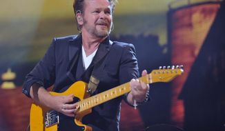 FILE - In this Sept. 21, 2013 file photo, John Mellencamp performs in Saratoga Springs, N.Y. Mellencamp, a liberal rocker, wants conservative Wisconsin Republican Gov. Scott Walker to know he supports union rights and says Walker should think about that before using his songs on the campaign trail.(AP Photo/Hans Pennink, File)