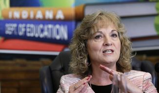FILE - Glenda Ritz, Indiana Superintendent of Public Instruction, shown in this June 10, 2013 file photo, as she talks about interruptions experienced by students taking ISTEP tests. Indiana education leaders are rapidly approaching a deadline to approve new education standards to replace the national Common Core standards, which lawmakers and Gov. Mike Pence agreed to ditch. But infighting between state schools chief Glenda Ritz and the state Board of Education is putting new standards at risk. (AP Photo/Michael Conroy, File)