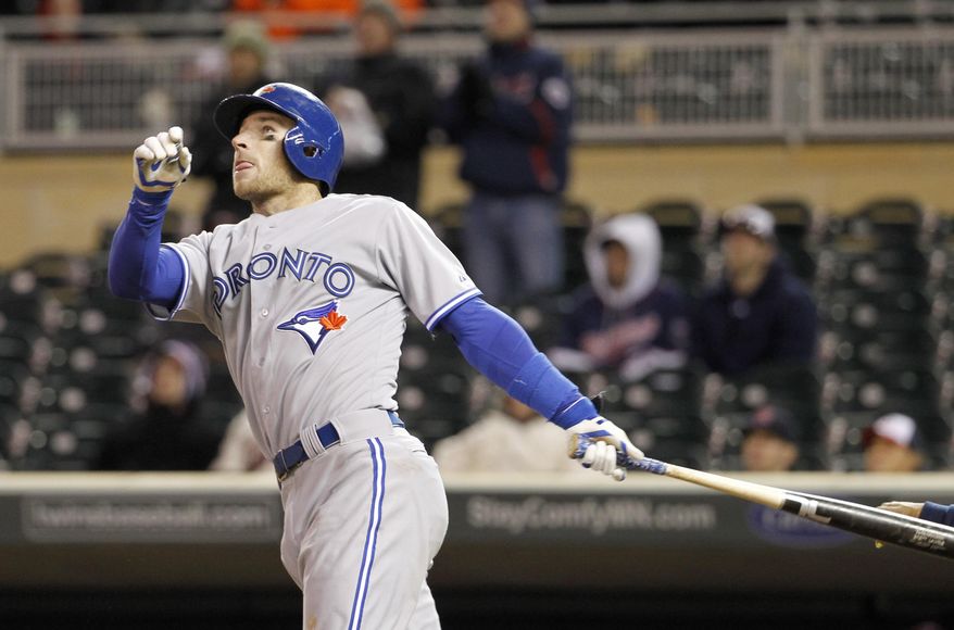 Toronto Blue Jays' Brett Lawrie watches the flight of his grand slam off Minnesota Twins relief pitcher Jared Burton during the ninth inning of a baseball game in Minneapolis, Tuesday, April 15, 2014. The Blue Jays won 9-3. (AP Photo/Ann Heisenfelt)
