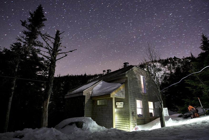 In this Thursday, April 3, 2014 photo, stars fill the sky above the Gray Knob cabin, a first-come, first-served hiker's camp located just below the tree line, 3.2 miles from Route 2 in Randolph, N.H. The cabin is one the Randolph Mountain Club's remote facilities open to hikers in the Northern Presidential Range. (AP Photo/Robert F. Bukaty)