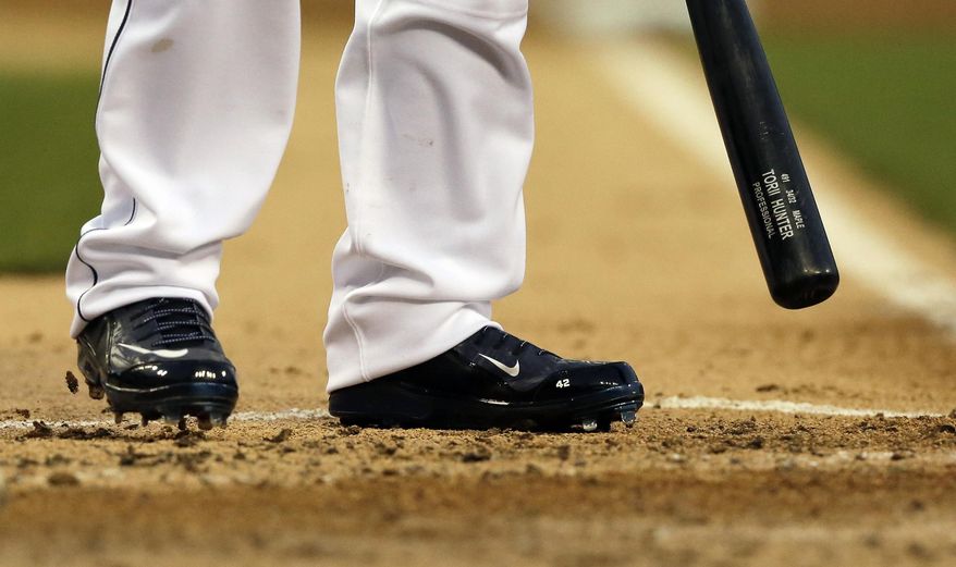 Detroit Tigers&#39; Torii Hunter, wearing shoes with Jackie Robinson&#39;s number 42, stands in the batters box during the third inning of a baseball game against the Cleveland Indians in Detroit, Wednesday, April 16, 2014. (AP Photo/Carlos Osorio)