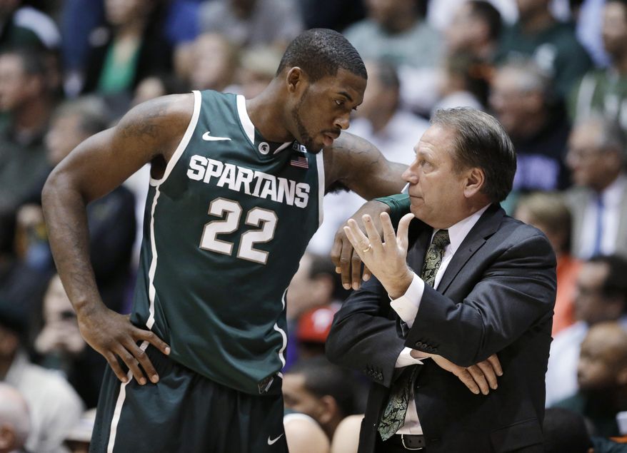 FILE - In this Jan. 15, 2014, file photo, Michigan State guard Branden Dawson, left, listens to coach Tom Izzo during an NCAA college basketball game against Northwestern in Evanston, Ill. Dawson is staying for his senior season. The school announced Dawson's decision Tuesday, April 15, 2014. He averaged a career-high 11.2 points last season. (AP Photo/Nam Y. Huh, File)