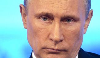 Russian President Vladimir Putin takes part in a televised call-in show with the nation in Moscow, Thursday, April 17, 2014. (AP Photo/RIA-Novosti, Alexei Nikolsky, Presidential Press Service)