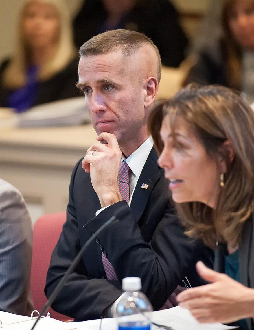 In this Feb. 24, 2014 photo, Delaware Attorney General Beau Biden and State Prosecutor Kathy Jennings attend a budget hearing at Legislative Hall in Dover. Biden says he won&#x27;t seek re-election as Delaware attorney general this year but plans to run for governor in 2016. Biden, who underwent surgery at a Texas cancer center last year, announced his intentions in a statement issued Thursday, April 17, 2014. The 45-year-old Biden had said previously that he would seek a third term as attorney general. He is the oldest son of Vice President Joe Biden.  (AP Photo/The Wilmington News-Journal, Jason Minto)  NO SALES