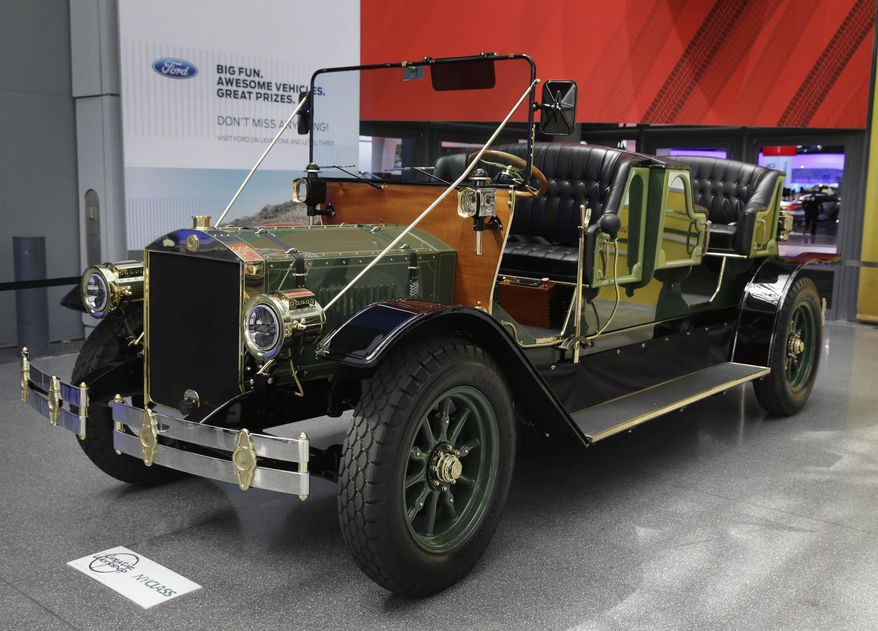 A prototype of an electric carriage is displayed at the New York International Auto Show in New York, Thursday, April 17, 2014. A prototype of the old-timey electric cars that Mayor Bill de Blasio would like to take the place of horse-drawn carriages on New York City streets will be unveiled at the New York Auto Show on Thursday. (AP Photo/Seth Wenig)