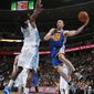 Golden State Warriors guard Steve Blake, right, prepares to pass around Denver Nuggets forward Kenneth Faried during the first quarter of an NBA basketball game in Denver on Wednesday, April 16, 2014. (AP Photo/David Zalubowski)