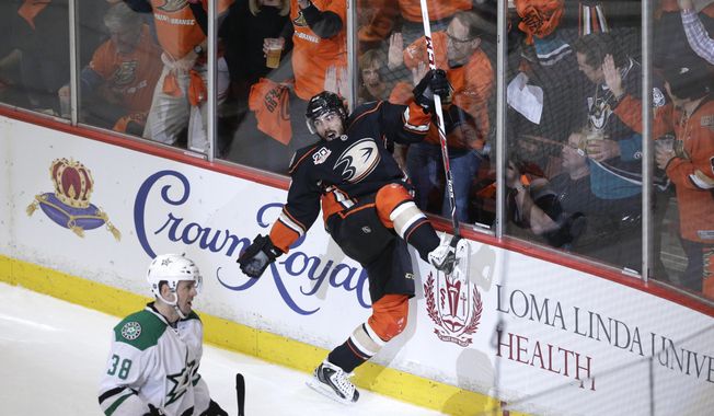 Anaheim Ducks&#x27; Mathieu Perreault, center, celebrates his goal near Dallas Stars&#x27; Vernon Fiddler during the first period in Game 1 of the first-round NHL hockey Stanley Cup playoff series on Wednesday, April 16, 2014, in Anaheim, Calif. (AP Photo/Jae C. Hong)