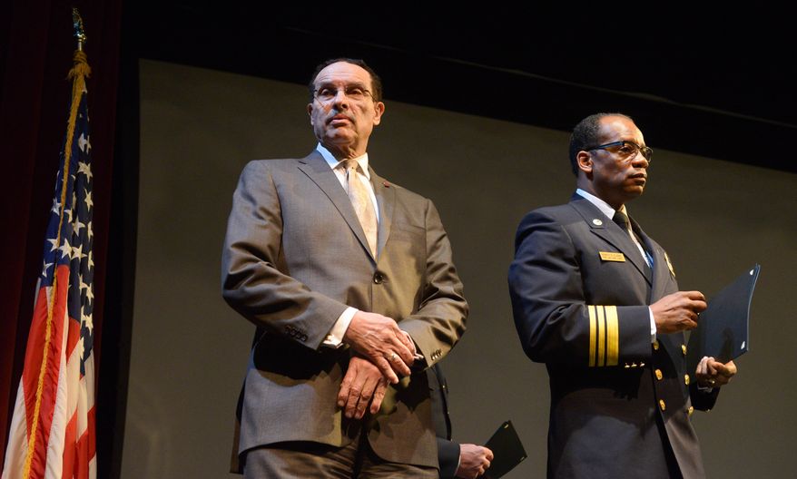 Mayor Vincent Gray, (D) and D.C. Fire &amp; Emergency Medical Services Chief Kenneth Ellerbe awaitsgraduates of  Recruit Class 367 graduation at Gallaudet University in Northeast on April 17. Khalid Naji-Allah /Special to The Washington Times