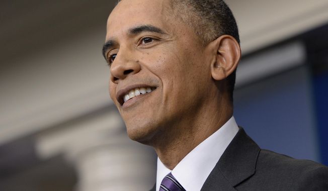 President Barack Obama smiles as he speaks in the briefing room of the White House in Washington, Thursday, April 17, 2014. The president spoke about health care overhaul and the situation in Ukraine.  (AP Photo/Susan Walsh)